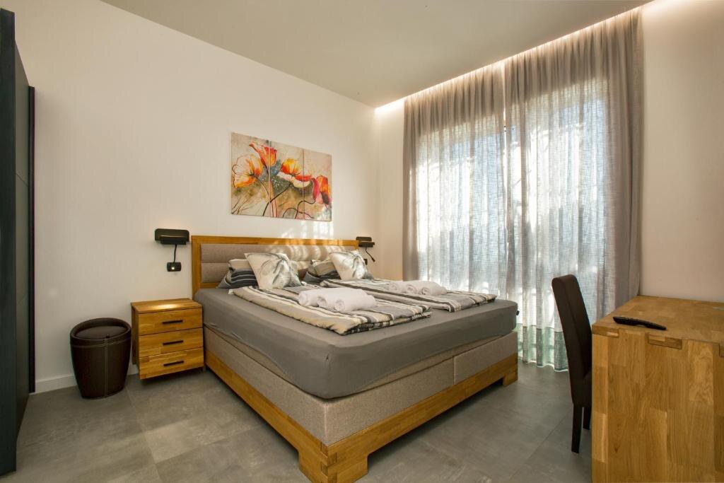 Bedroom with wooden furniture and soft daylight