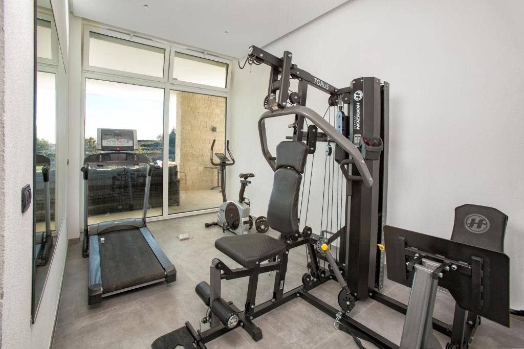 Fitness room with treadmill, exercise bike and multi-station machine