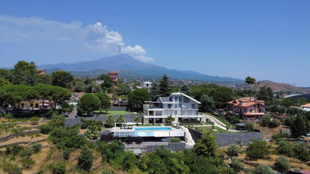 Villa Rita seen from the air with Mount Etna in the background